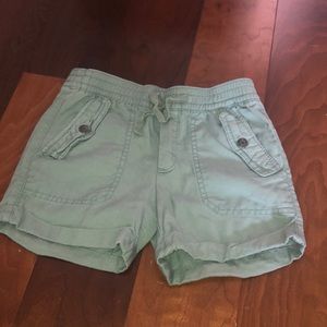 Kids army green shorts.